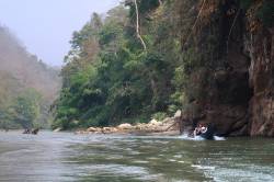 HKU landscape students on longboats within planned reservoir area on tributary of the Salween (Thanlwin/Nujiang) River, Thailand. By Ashley Scott Kelly, 2023.