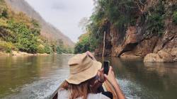HKU landscape students on longboats within planned reservoir area on tributary of the Salween (Thanlwin/Nujiang) River, Thailand. By Ashley Scott Kelly, 2024.
