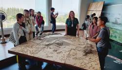 HKU landscape students speak with docents from the Electricity Generating Authority of Thailand (EGAT) at Mae Moh Coal Mine Museum, Lampang province. By Ashley Scott Kelly, 2024.