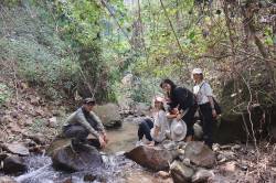 HKU landscape students trekking along a small tributary of the planned reservoir area. By Kuan Pui Shan Kimmy, 2024.