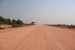 New highway bisecting Panyanivej Organic Farm, Vientiane, Laos. By TANG Chun Wah Richard, 2019.